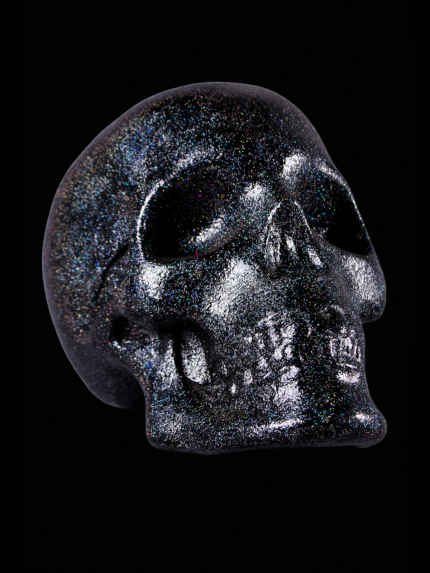 Escultura de craneo brillante